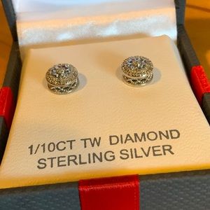 Diamond and Sterling silver earrings.